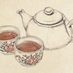 Teekanne und zwei Tassen
